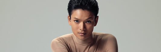 image of a woman with dark hair donning a pixie style cut