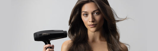 image of a woman holding a blow dryer