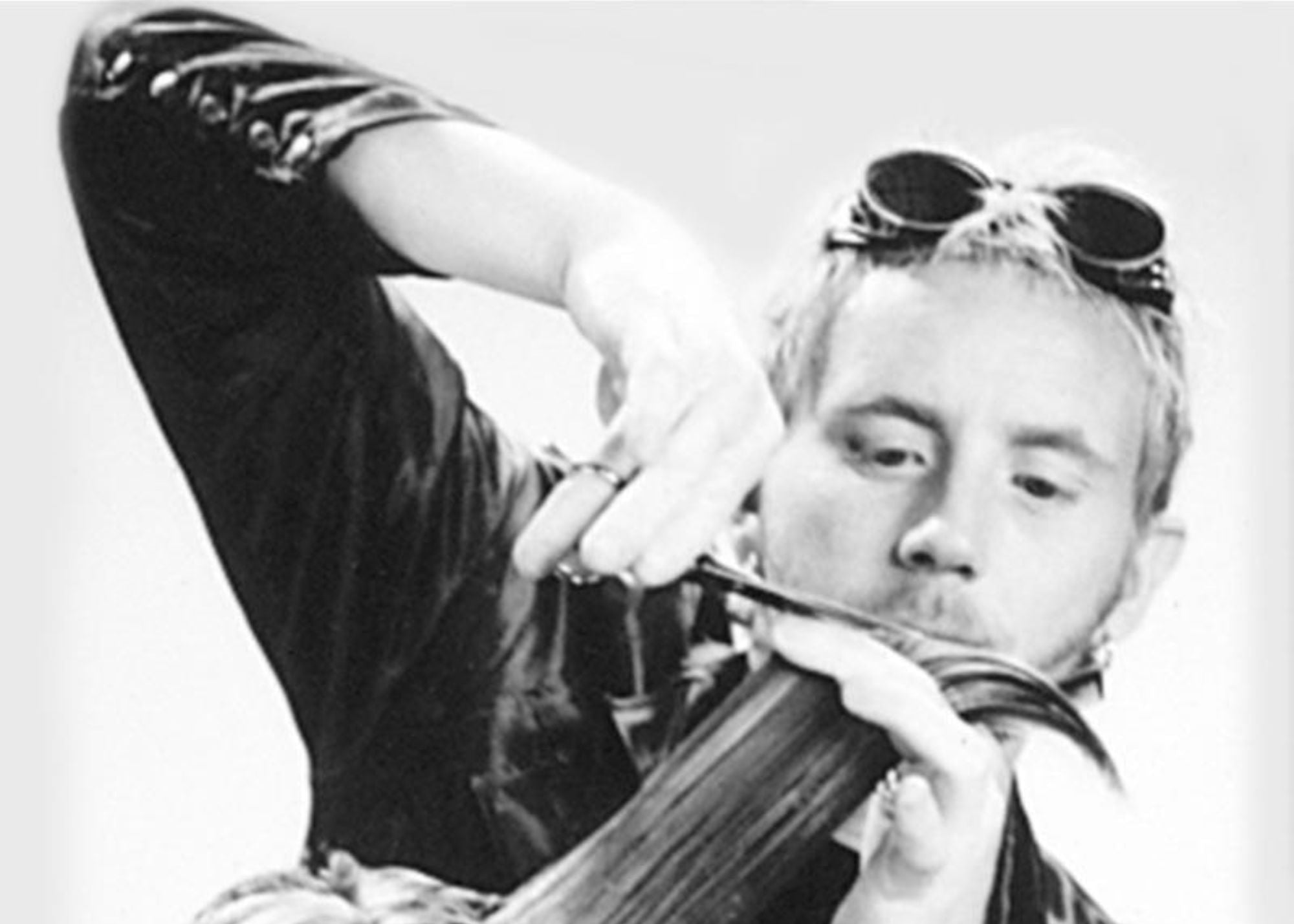 Professional hairstylist using shears on a model