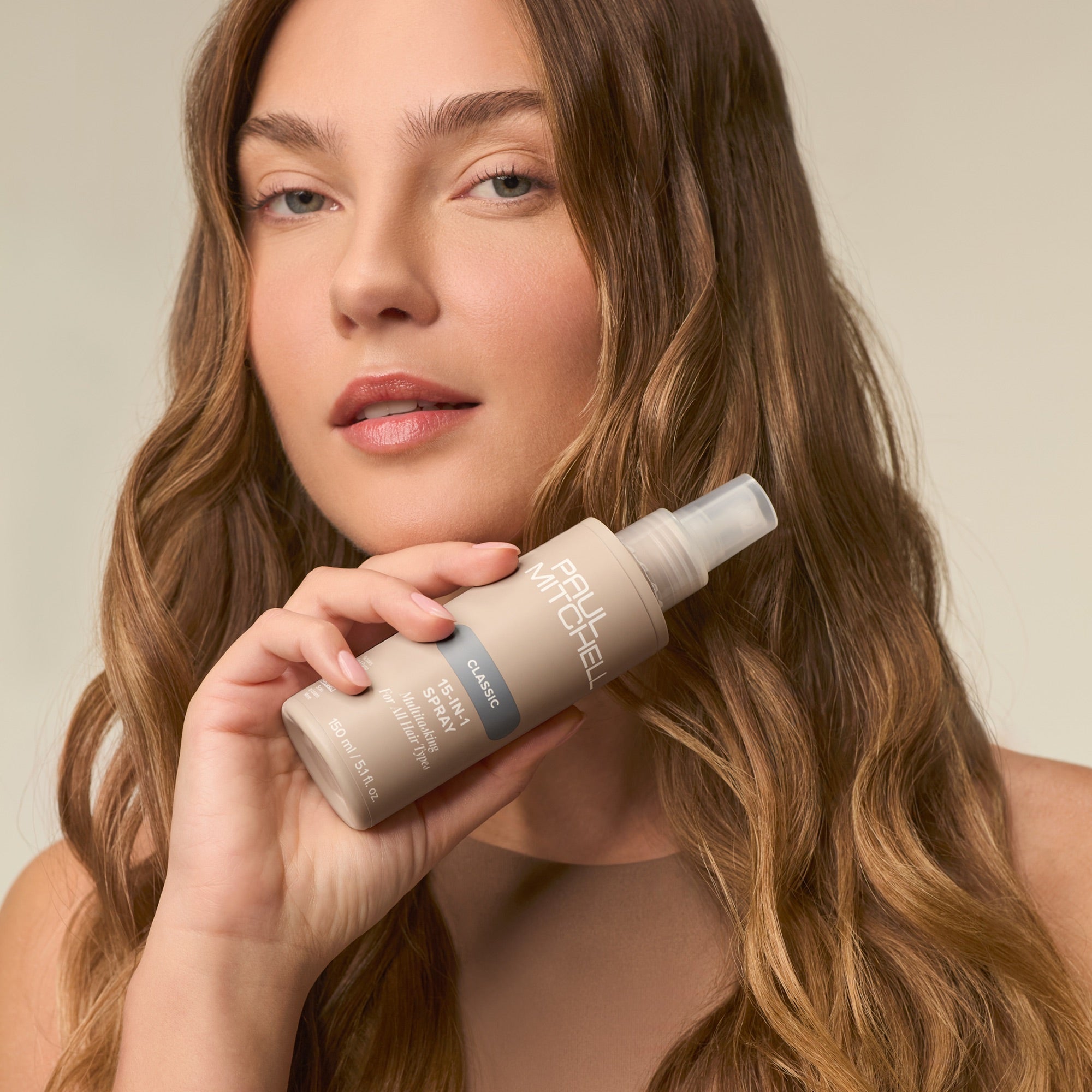 Paul Mitchell 15-In-1 Spray instantly transforms hair with 15 key benefits including improved hydration and frizz control.