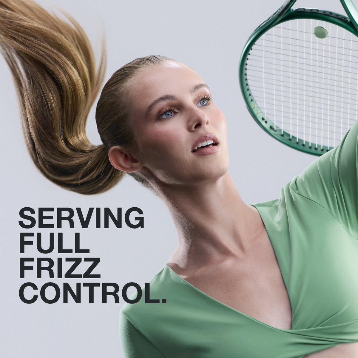 Model playing tennis with graphic text: Serving full frizz control.