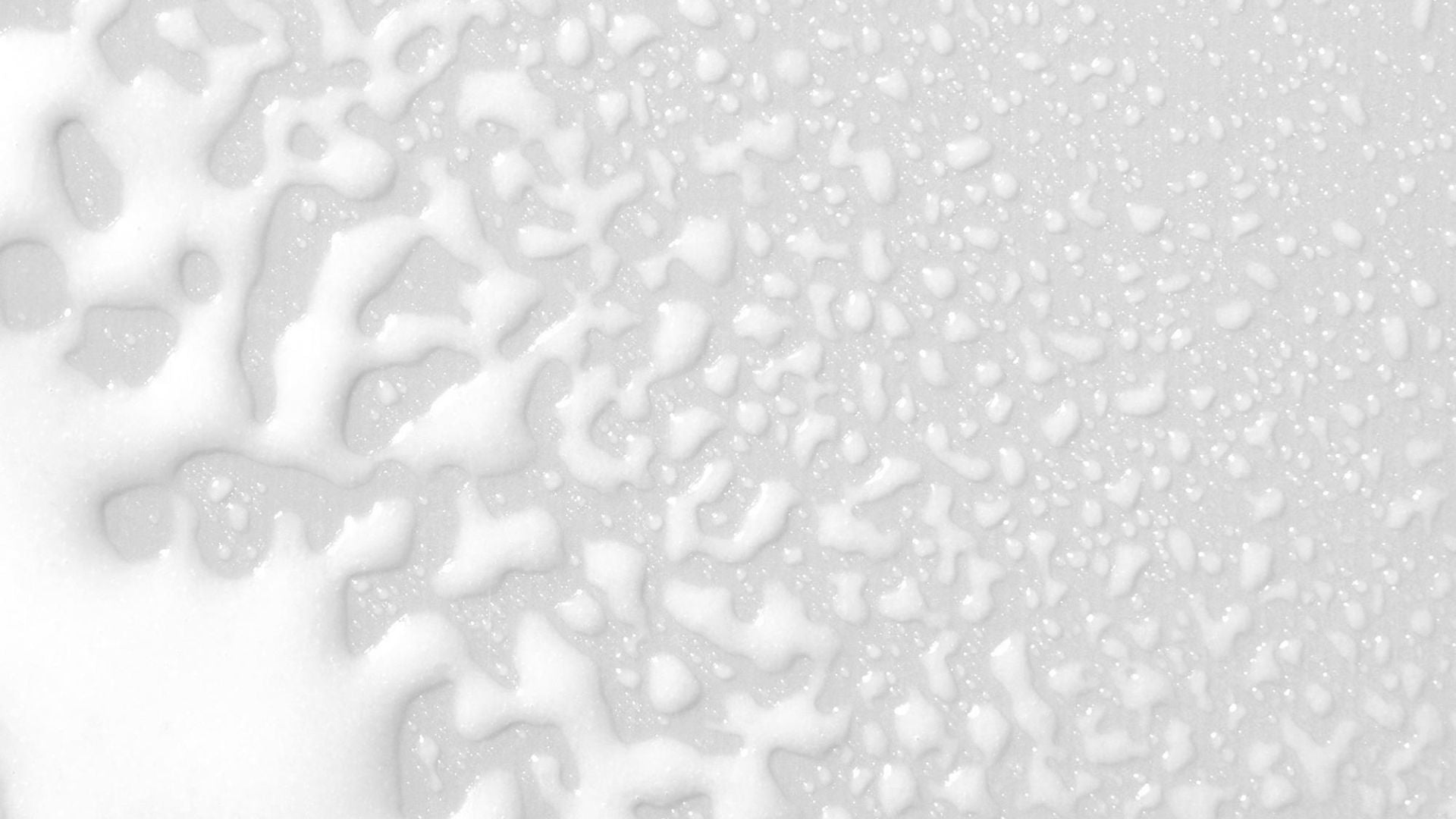 Close-up of Paul Mitchell Refreshing Mist smear on a neutral background.