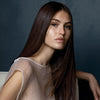 image of a woman with long, straight brunette hair