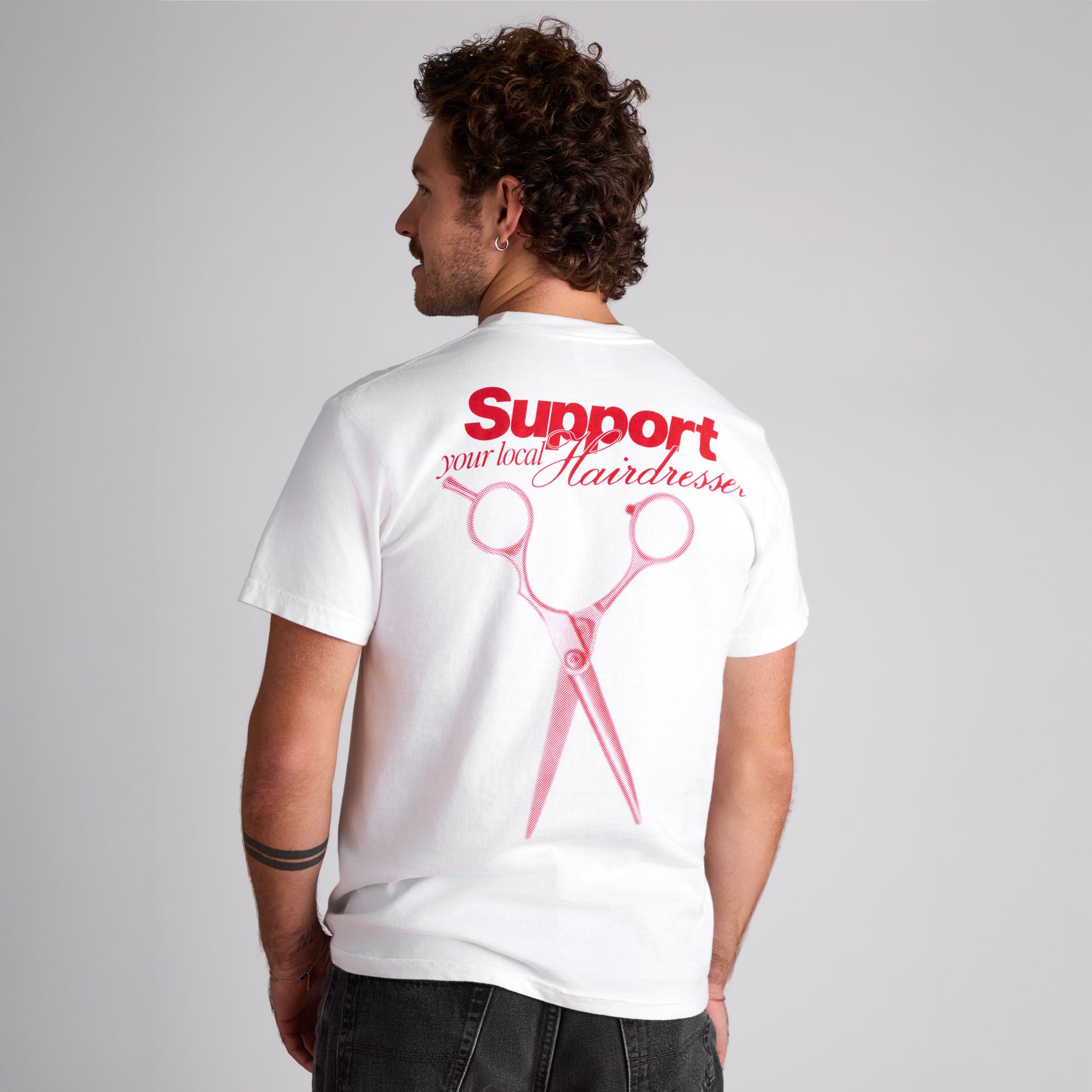 image of model wearing the Paul Mitchell Support Your Local Hairdresser T-Shirt