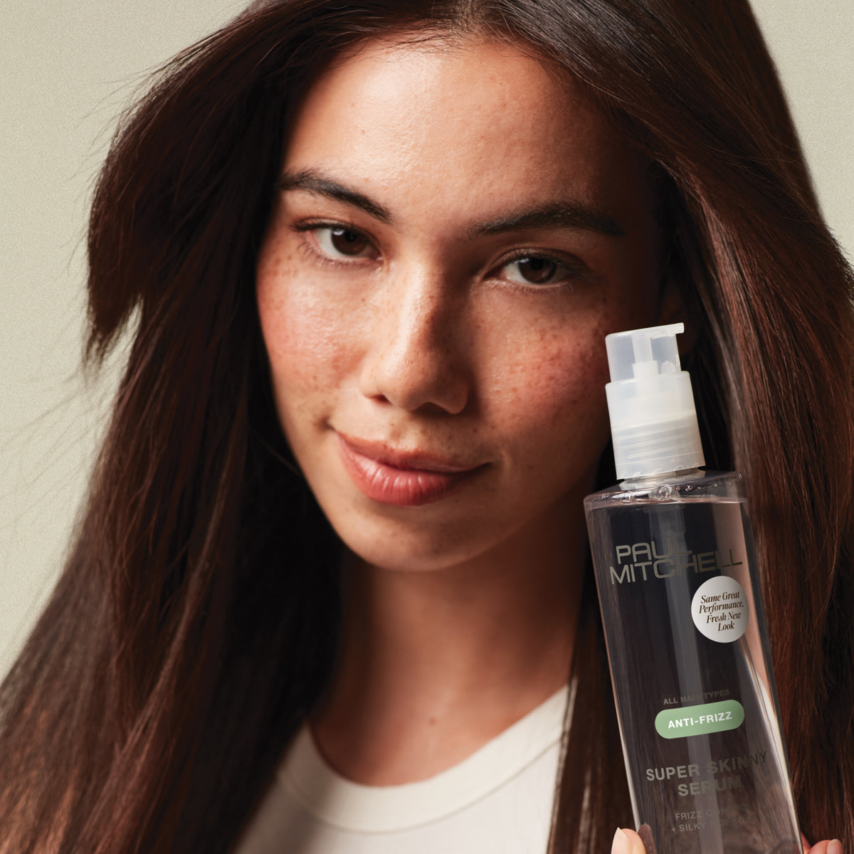 Model holding Super Skinny Serum