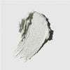 Tea Tree Special Detox Foaming Salt Scrub smear on a neutral background