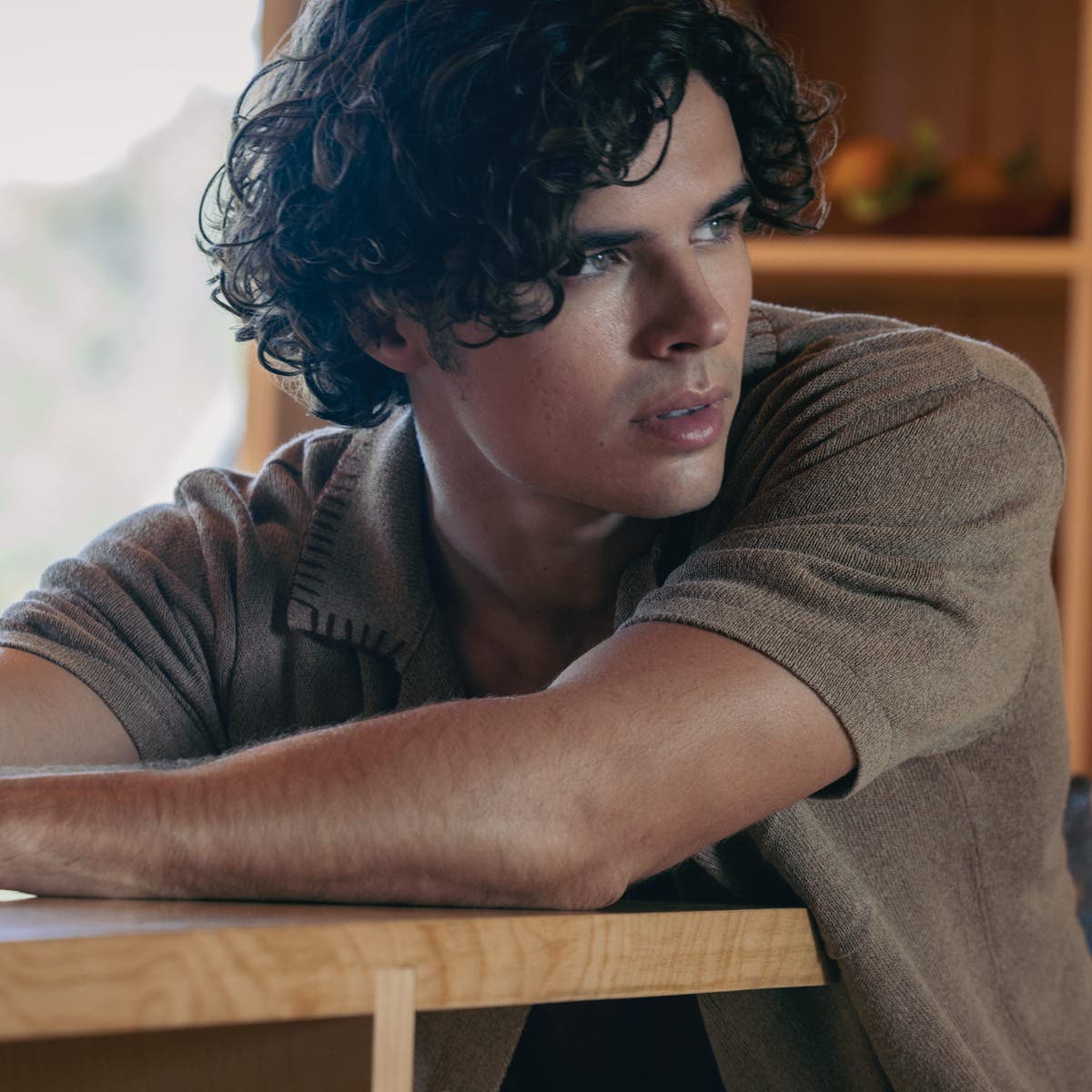 Tea Tree male model with curly finished look in lifestyle setting