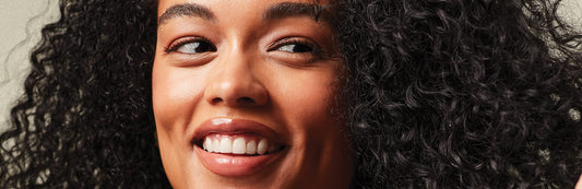 image of a woman with long, curly black hair