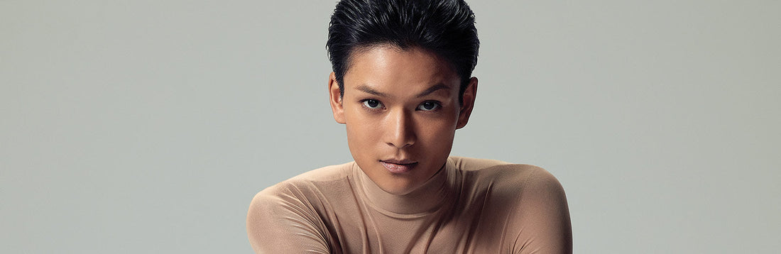 image of a woman with dark hair donning a pixie style cut