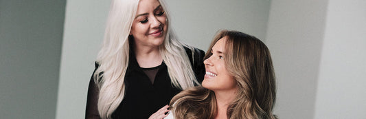 image of a stylist smiling at her client