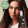 Model holding Super Skinny Serum with claim: #1 Smoothing Serum sold in salons in the US, based on Kine PRO data Q3 2024-Q2 2025.