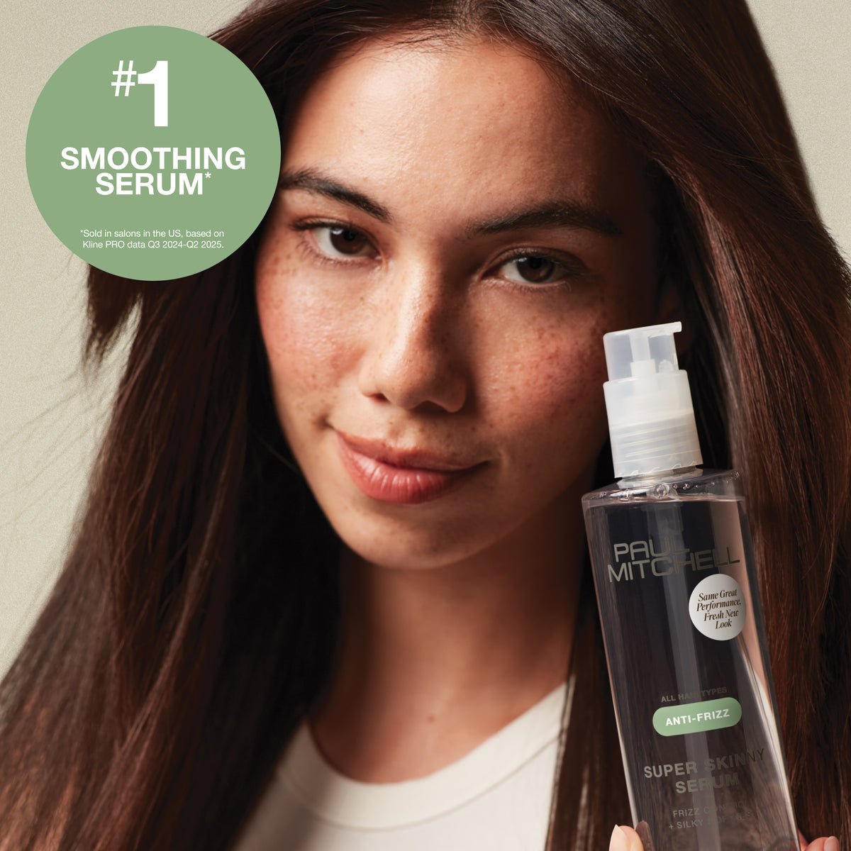 Model holding Super Skinny Serum with claim: #1 Smoothing Serum sold in salons in the US, based on Kine PRO data Q3 2024-Q2 2025.