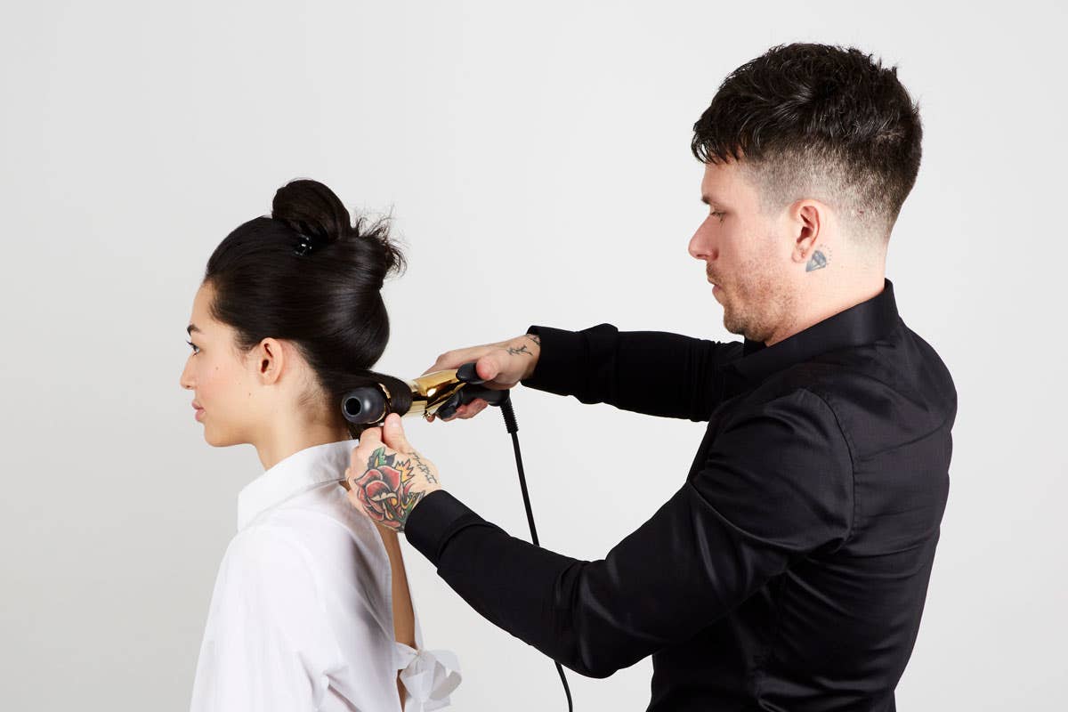 How To: Bouncy Half-Up Pony Step 6 of 14. Use Express Ion Gold Curling Iron 1.5". Start at base of hair.