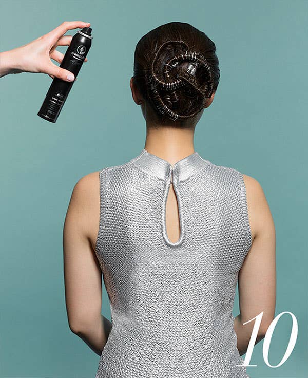 How to Add Flair to Holiday Hair with Awapuhi Wild Ginger Step 10 of 10, spray bun with Awapuhi Wild Ginger Shine Spray.