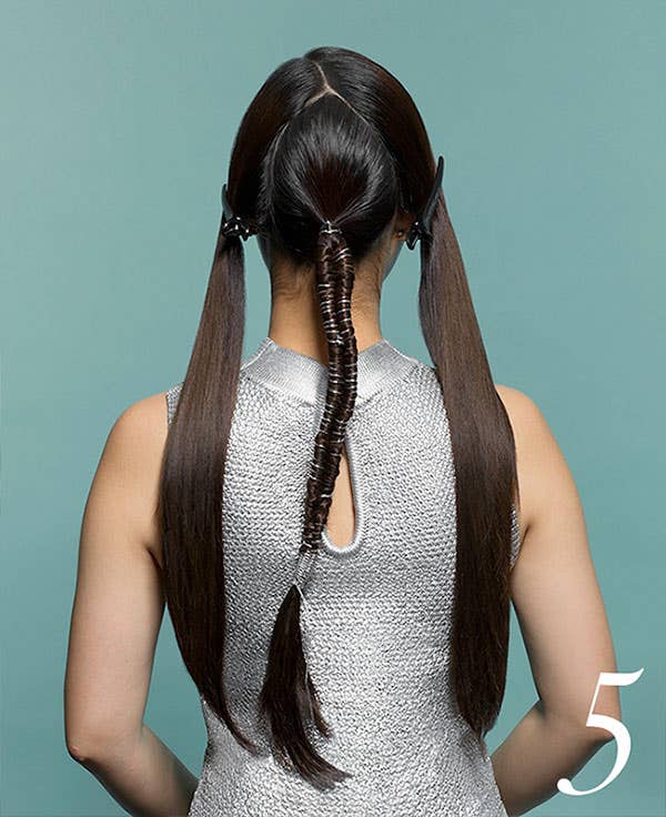 How to Add Flair to Holiday Hair with Awapuhi Wild Ginger Step 5 of 10. Completed middle ponytail with string wrapped within.