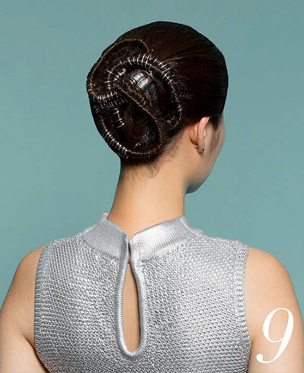 How to Add Flair to Holiday Hair with Awapuhi Wild Ginger Step 9 of 10. View of 3 sections wrapped into bun with silver strings intertwined.