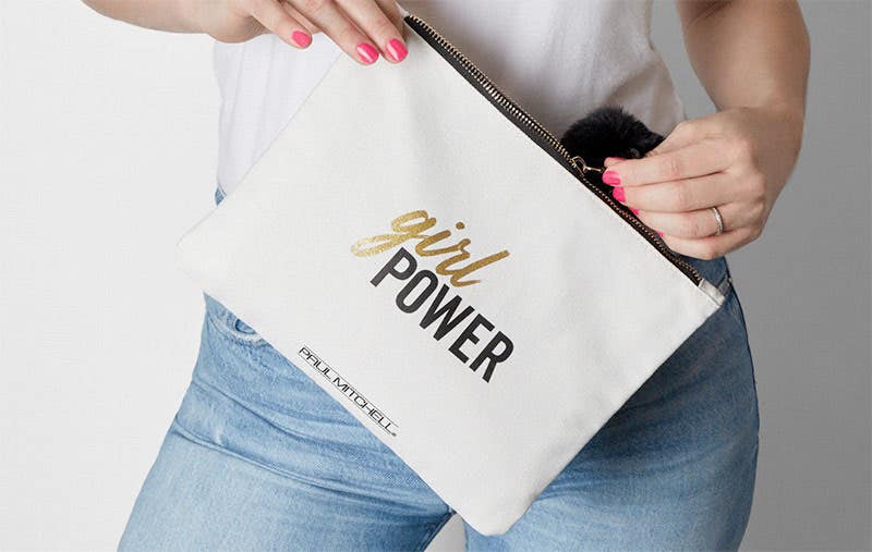 image of a model holding the limited edition #girlpower heat-safe tool bag