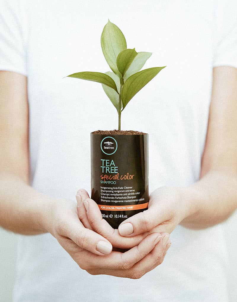 image of a model holding a Tea Tree bottle