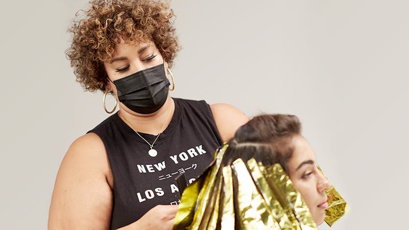 Image of stylist and client in salon