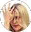 image of woman sliding finger down scalp